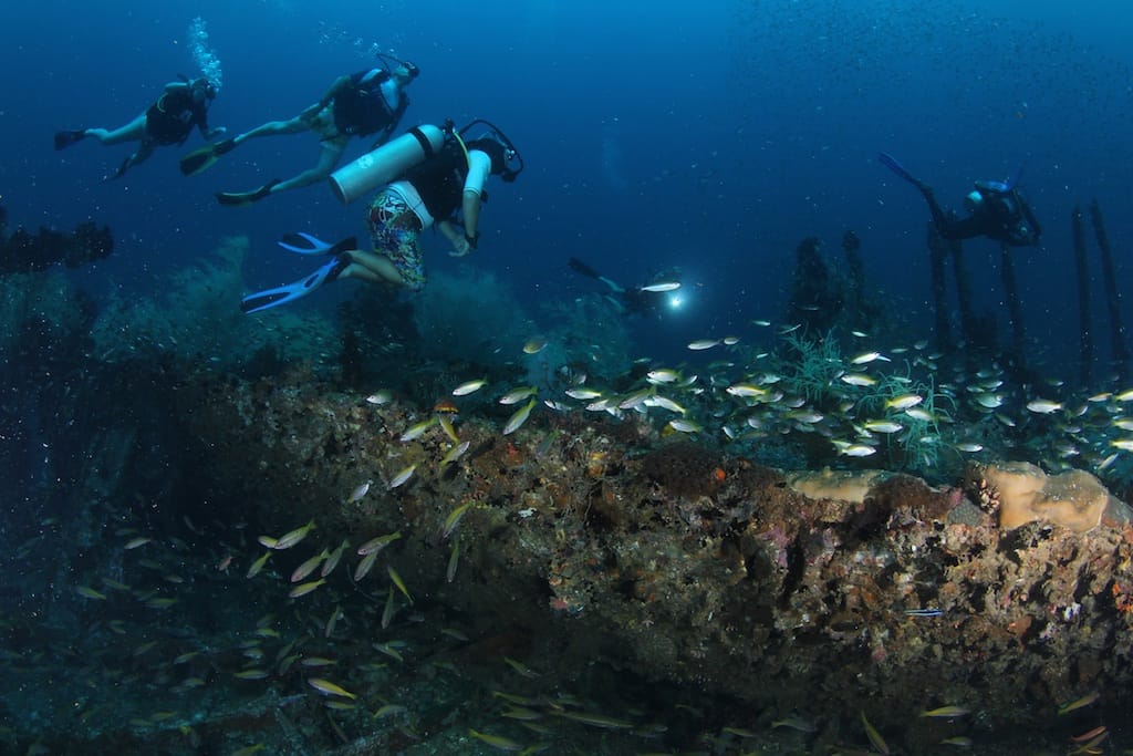 Scuba divers deep diving Kota Belud Sabah