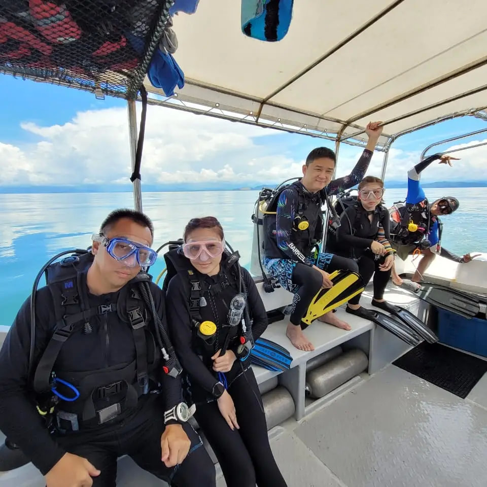 Scuba divers on dive boat Bigfin divers Sabah Borneo